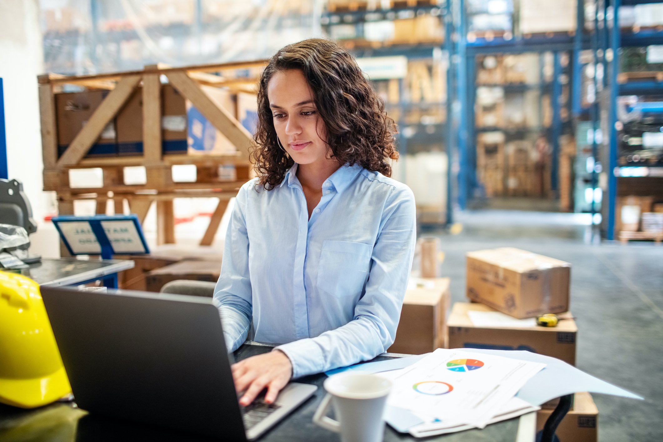 Young marketing professional on manufacturing floor