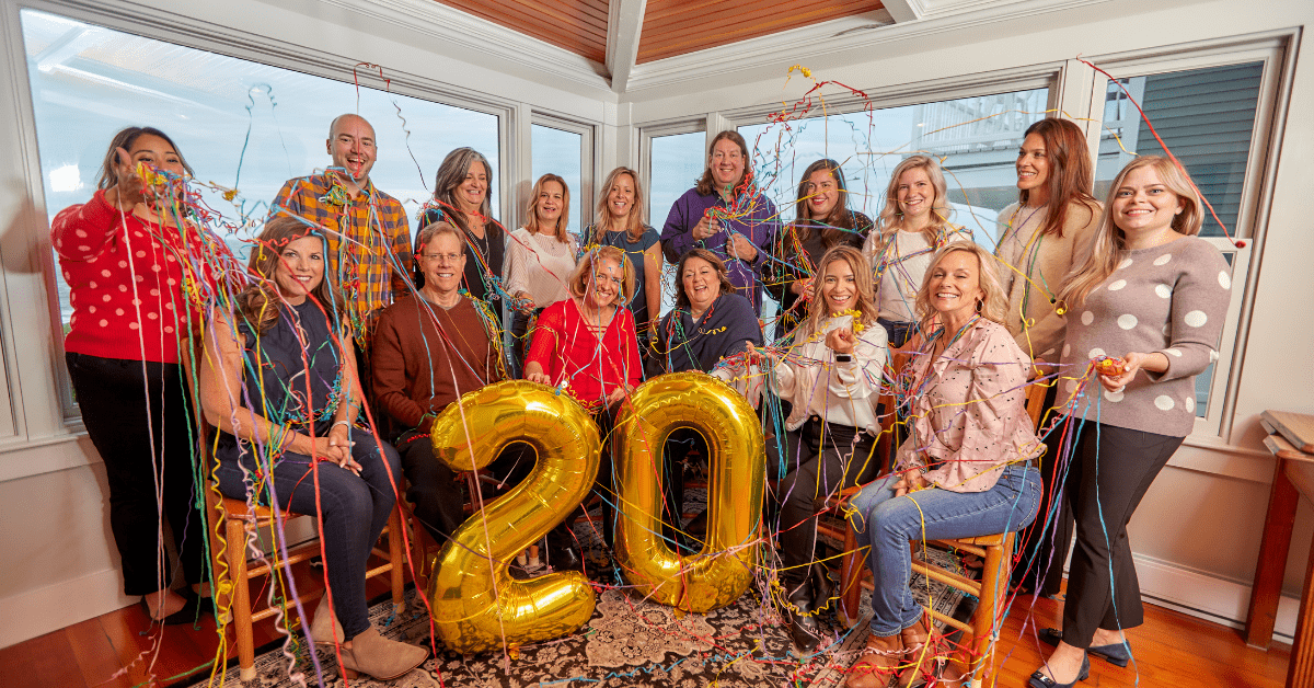 Marketing Team Celebrating 20th Anniversary with Steamers and Balloons 